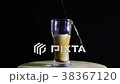 pouring coca cola juice into clean glass isolated 38367120
