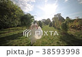 Bride running in the park in the sunlight fly-cam 38593998
