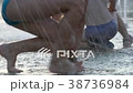 Children play in the fountain. Bare feet in a 38736984