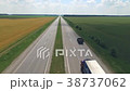The road in rural areas passes between fields 38737062