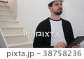 Bearded construction engineer holding digital 38758236