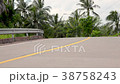 fitness woman running at tropical forest trail 38758243
