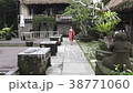 A cute woman goes for a walk in a hotel on Bali 38771060