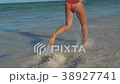 SLOW MOTION Running athletic thin girl sea coast 38927741