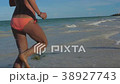 SLOW MOTION Running athletic thin girl sea coast 38927743