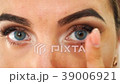 Beautiful girl contact lens in her eye close up 39006921