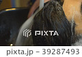 Close-up of a young man having his hair washed in 39287493