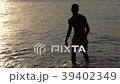 Silhouettes young friends playing beach football 39402349