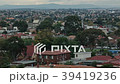 High angle rooftops with train leaving station 39419236