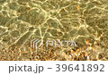 Shallow water caustics and yellow beach sand backg 39641892