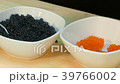 Spread the red salmon caviar in a cup next to 39766002