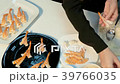 The cook makes sushi with shrimps 39766035