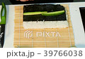 The cook makes a roll with rice outside. Fast 39766038