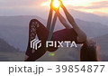 Woman practicing fly-dance yoga poses in a hammock 39854877