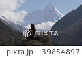 Meditation in front of snow-capped peaks 39854897