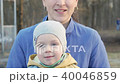 Mother and baby are playing merrily tease during the sunny mild of the sunset. In the outdoors of 40046859