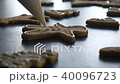 Gingerbread man cookie is decorated with glaze, closeup FullHD color graded 40096723