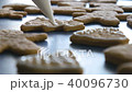 Cookie in shape of christmas tree is decorated with glaze, closeup color graded 40096730