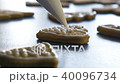 Cookie in shape of heart is decorated with glaze, closeup FullHD color graded 40096734