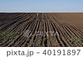 Farmer in cultivated field ready for sowing 40191897