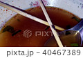 Flies eat food scraps in noodle cups. 40467389