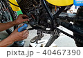 Mechanic repairing the electrical system in the mo 40467390