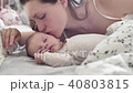 beautiful young mother smile and kiss her newborn child 40803815