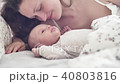 beautiful young mother smile and kiss her newborn child 40803816