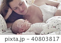 beautiful young mother smile and look at her newborn child 40803817