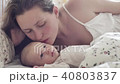 beautiful young mother smile and kiss her newborn child 40803837