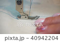 professional sewing machine, middle-aged woman's hands 40942204