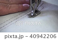 professional sewing machine, middle-aged woman's hands 40942206