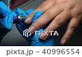 start of manicure. manicure with the help of a nail polish machine. 40996554