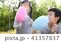 Little girl and boy eating cotton candy in park 41357837