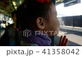 Little girl kissing train window and writing 41358042