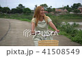 Young woman with bicycle walking on the park 41508549