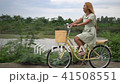Young woman with bicycle walking on the park 41508551