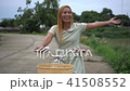 Young woman with bicycle walking on the park 41508552