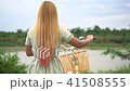 Young woman with bicycle walking on the park 41508555