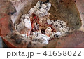 Burning charcoal on the stove; Charcoal in the fir 41658022