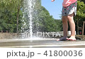 Girls leg and feet wet in fountain 41800036