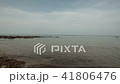 Deserted beach and several ships on the horizon. 41806476