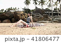 Sexy girl lying on the beach in a swimsuit and shorts in the sun. 41806477