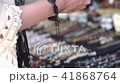 Young smiling girl trying colored bracelets in the store 41868764