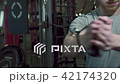 Close up of sportsman, who is doing xable exercise in modern gym. 42174320