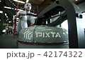 Young sportsman is doing seated cable rows in modern gym. 42174322