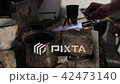 Heating the metal ingot with a burner 42473140