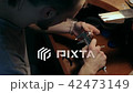 Jewelry master measures the diameter of the ring with a calipers 42473149