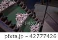 Band conveyer. Conveyor belt. Transportation of granulated raw materials to the warehouse 42777426