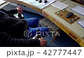 Industrial worker in control room 42777447